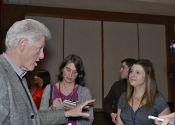 President Bill Clinton signs copies of his new book Back to Work