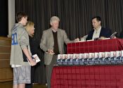 President Bill Clinton signs copies of his new book Back to Work at the Chappaqua Library for Chappaqua residents Michele and William Gregson. 