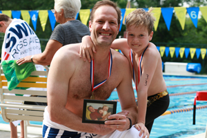 Teddy Meyer swimming with his dad Scott in honor of his grandfather