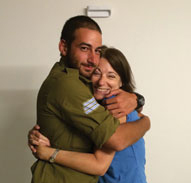 A hug and huge sigh of relief–Jill, with Eric right after he got out of Gaza.