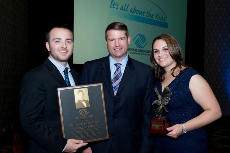 Photo/Lynda Shenkman Curtis: Cameron Rosen, the 2015 Chris Cutri Memorial Award recipient (left) and Jennifer Bonhomme, who accepted the 2015 John Beach Award on behalf of TD Bank (right), stand with BGCNW President R. Todd Rockefeller (center) and display their awards at the 21st annual Humanitarian Award Dinner Saturday, June 6 at the Westchester Hilton in Rye Brook. 