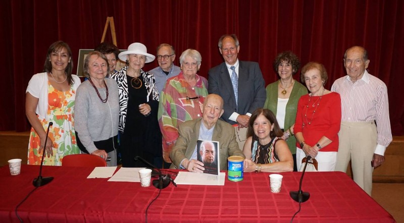 Among those gathering to honor Richard Laster (left to right): Millie Jasper, Executive Director of the Holocaust and Human Rights Education Center (HHREC); Lee Laster, Julie Scallero, Lee Katz, Gary Joseph, Valerie O’Keeffe (Chairperson of the HHREC Board), Clinton Smith , Joan Kuhn (Program Coordinator for the Chappaqua Library), Emily Grant, and Eugene Grant. Richard Laster is seated with his editor, Elinor Griffith. Photo by Grace Bennett.