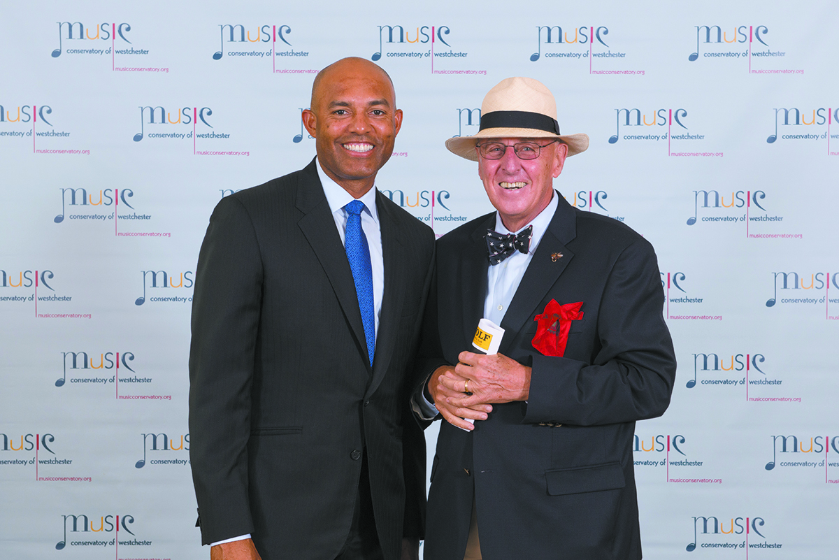 Former Yankee Mariano Rivera (left) and fellow honoree Robert Heath (right) share a couple of moments before the award ceremony.
