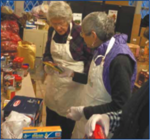 Meg Gregg (left) sorts food with other volunteers at the Inter- faith Food Pantry.